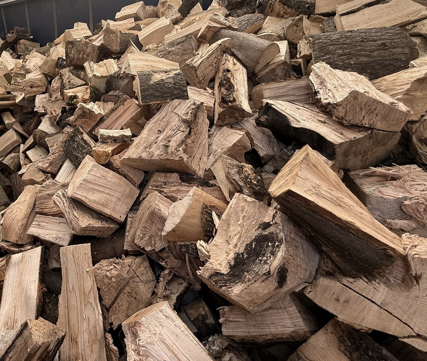 Split seasoned firewood stored under cover at Little Acres Firewood